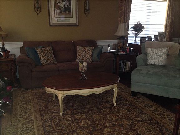 Our living room which contains a fireplace, media cabinet fo
