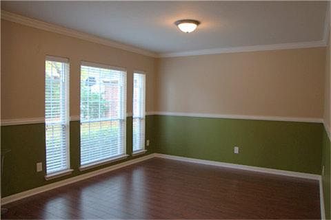 Alternate view of the dining room showing the large window facing the front of the home. Lots of nat