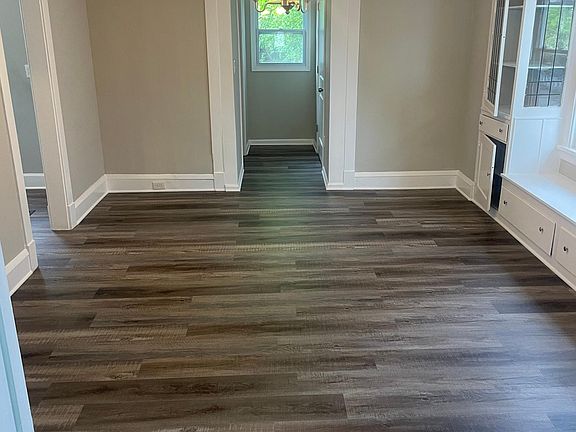 Dining room looking towards half-bath (straight) and kitchen (left)