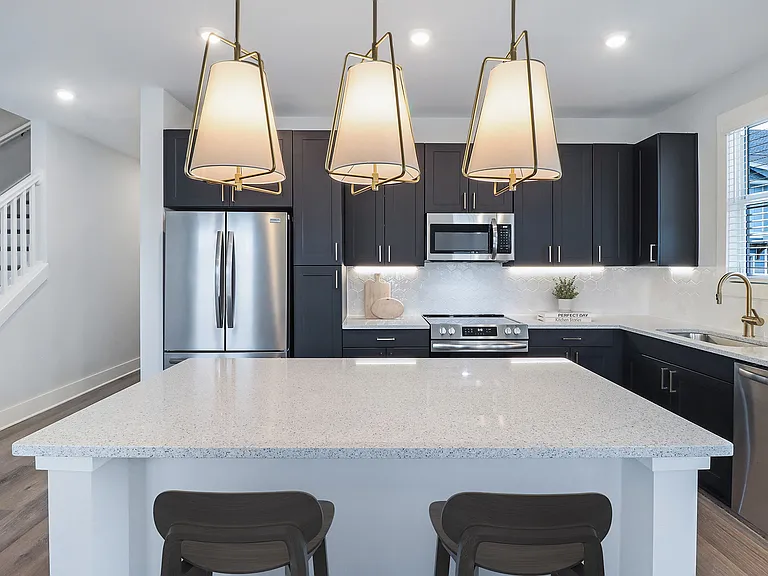 Sleek, two-toned European kitchen cabinets with under-cabinet lighting &amp; soft-close doors &amp; drawers