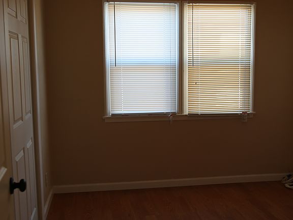 #2 Bedroom wood floors large long closet and ceiling fan