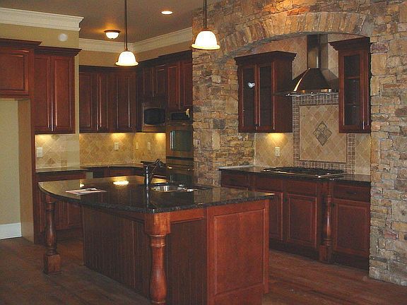 Eat-in island, granite counters, corner desk and walk-in pantry.