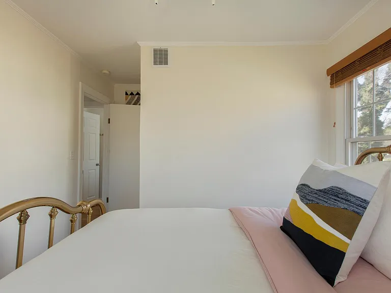 Small second bedroom. There is a good size closet with mirrored sliding doors as you enter the room (door is at left).