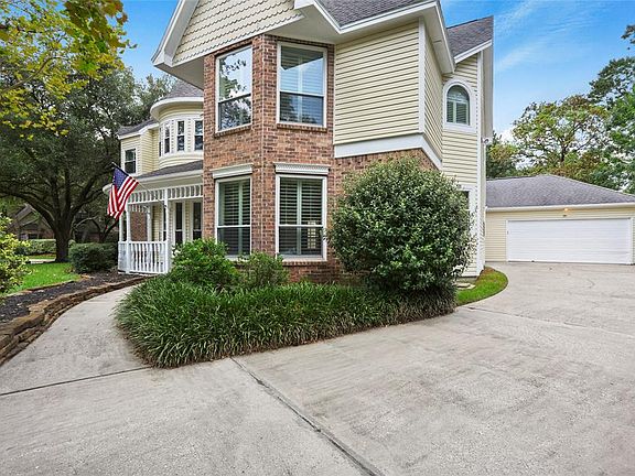 This long driveway provides ample parking space and leads to an oversized garage. With space for shelves and a works bench already provided this garage is perfect for home projects. It also has stairs leading to some finished attic rooms for storage.
