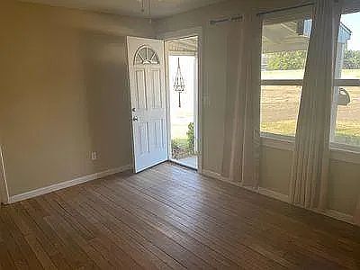 Front entry from porch and small patio. Dead bolt locks on front and rear door.