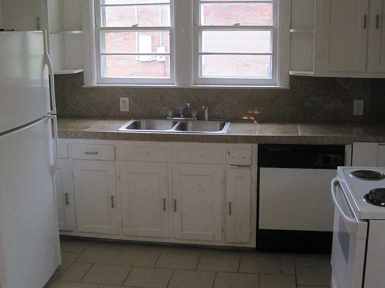 Full size refrigerator, stove and dishwasher. Granite countertops. Tile floors