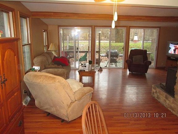 Lots of windows and bring the outside in. View of river from dining area and across living room .