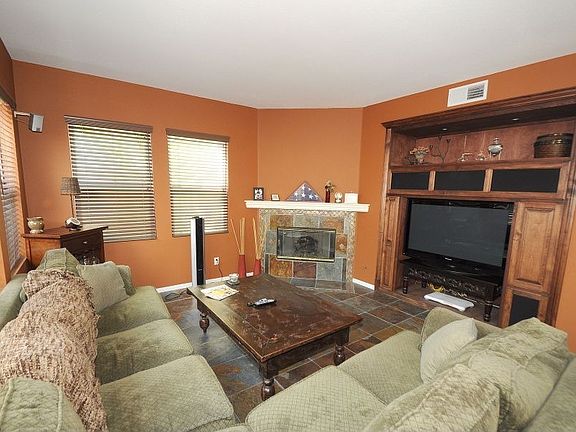 Living Room with Entertainment center & surround sound.