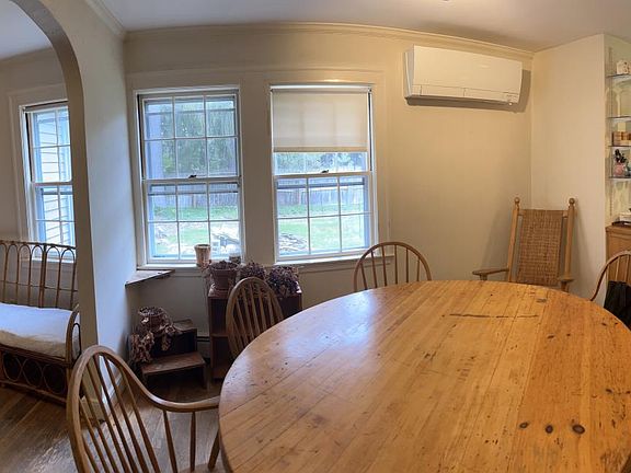 panorama of living room, dining room, kitchen