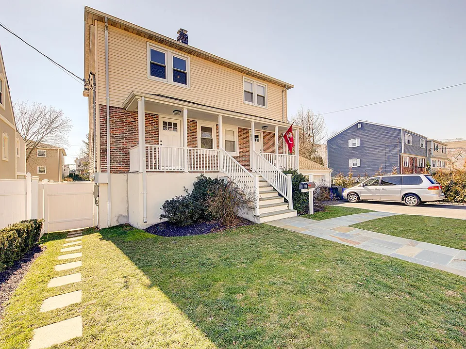 Street View - left unit. Pathway and gate to fenced in backyard.