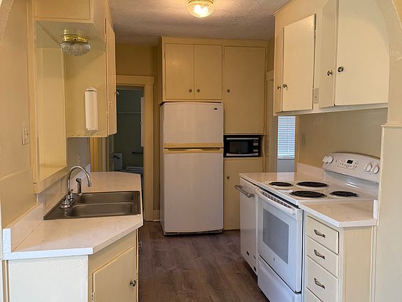 Roomy kitchen with plenty of storage, new countertops and new flooring