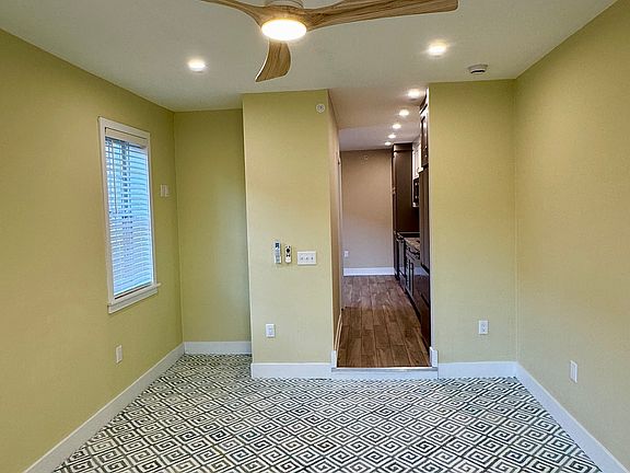 Living room with stylish ceiling fan/light