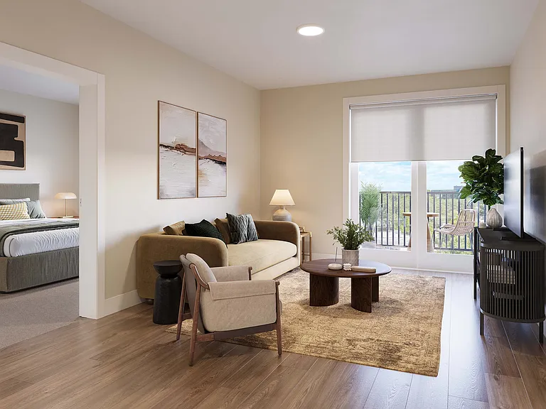 Bright, modern living room with cozy sofa, stylish decor, and balcony view, seamlessly connected to a serene bedroom.