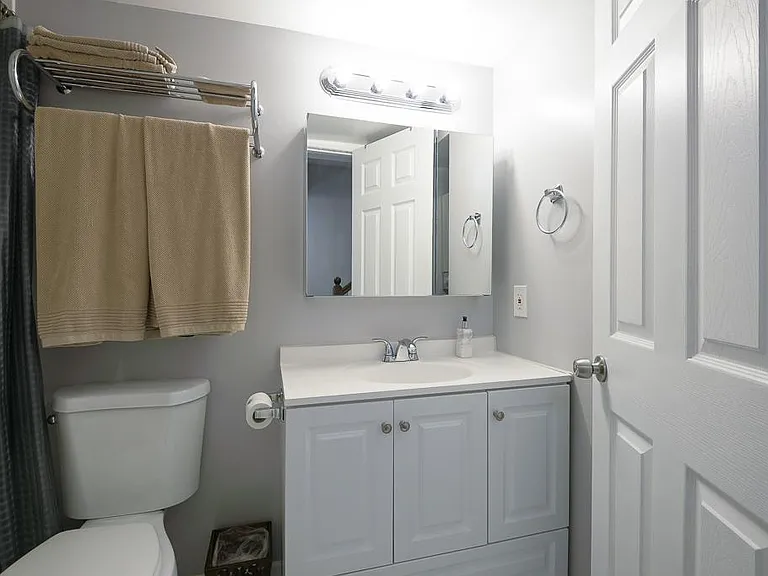 Full bath with shower on entry level of condo.