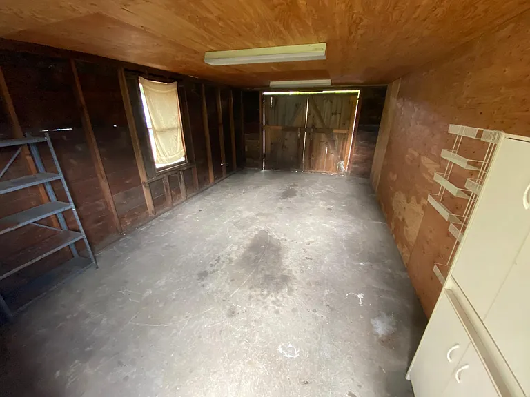 Single garage unit for storage (looking out toward barn door)