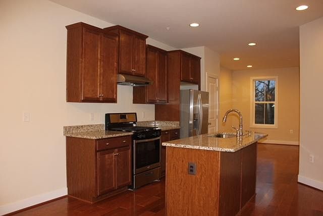 Picture taken from dining area looking into kitchen and livi