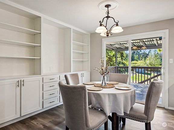 Dining area with built in cabinets.>