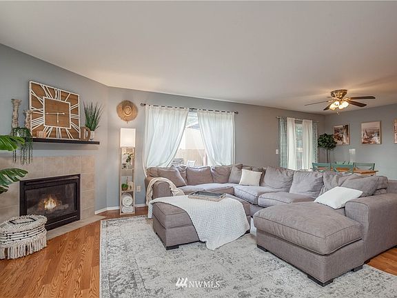 Living room includes beautiful gas fireplace