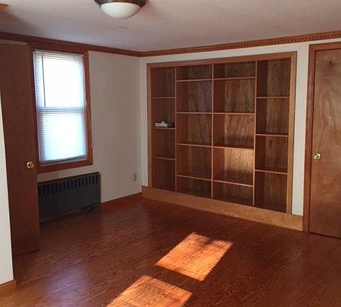 Second floor bedroom with builtin shelving