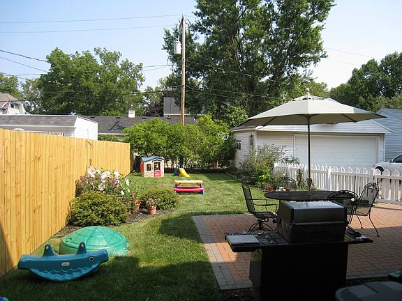 Fenced yard, nice landscaping, brick paver patio