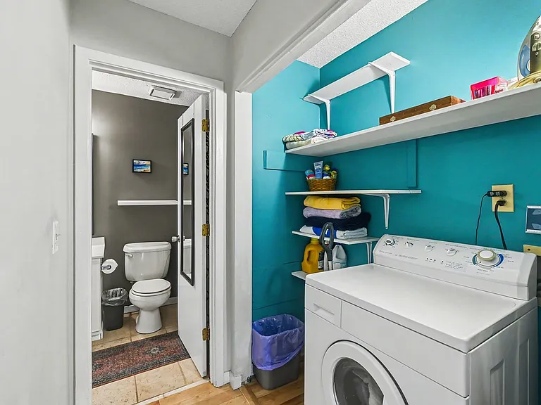 Laundry room with washer
