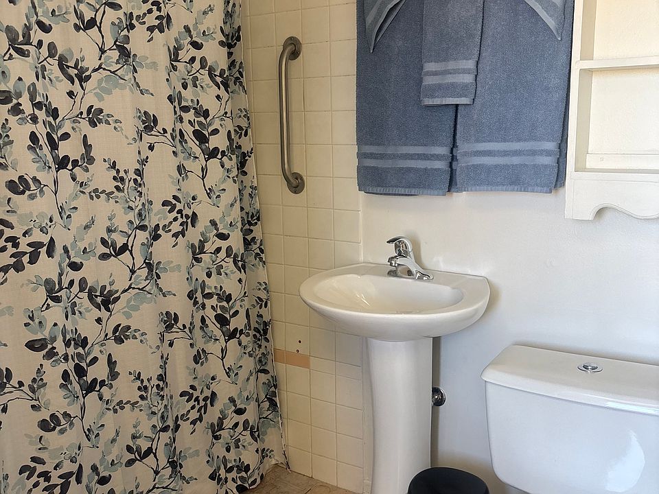Power flush toilet, new sink, walk-in shower.