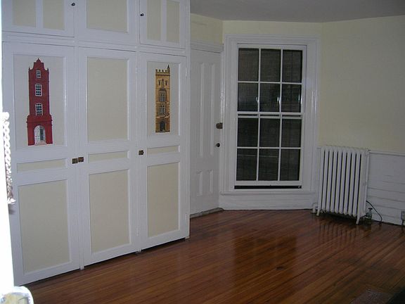 Great closet space. Window view is of alley and brick wall. Door to left of window is fire egress. Radiant heat via forced hot water.