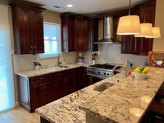 Chef's Kitchen with sliding door to back porch, private patio and 2-car parking.