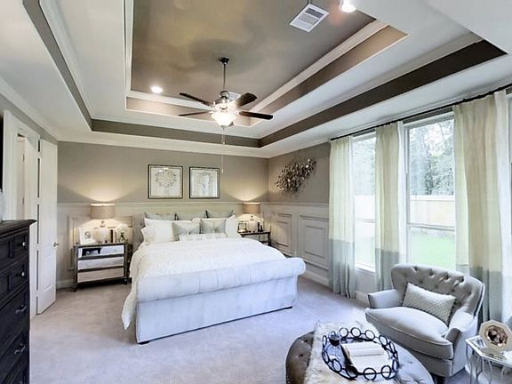 Situated at the back of the first floor beside the covered patio, the owner s suite enjoys added pri