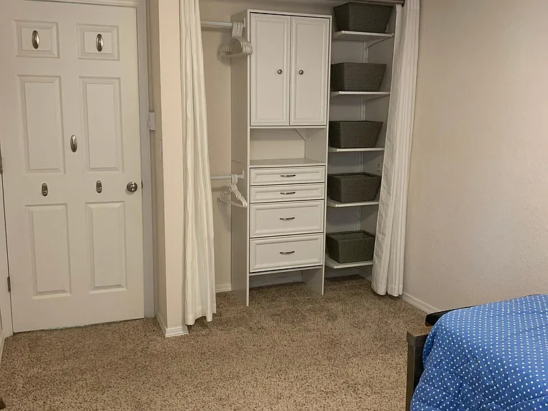 Closet organizer with 4 drawers/2 cabinets. Organizer can be built out with 2 or 4 hanging rods or 2 hanging rods and 5 shelves and 5 baskets. Designed to tenants satisfaction. Thermostat in room for bedroom heat only. Wall to wall carpet. Fan has a summ