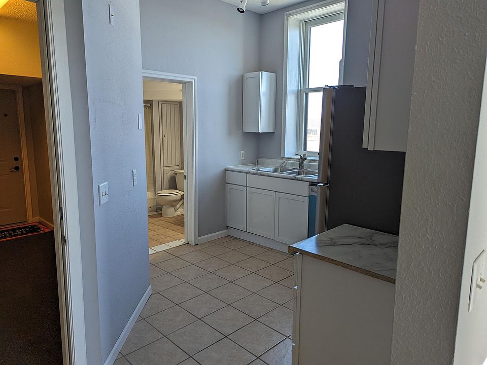 Kitchen with Entry door to unit on left side