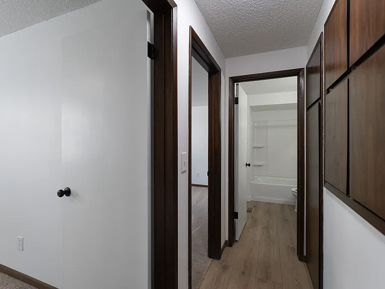 Hallway leading to bedrooms (left) and bathroom