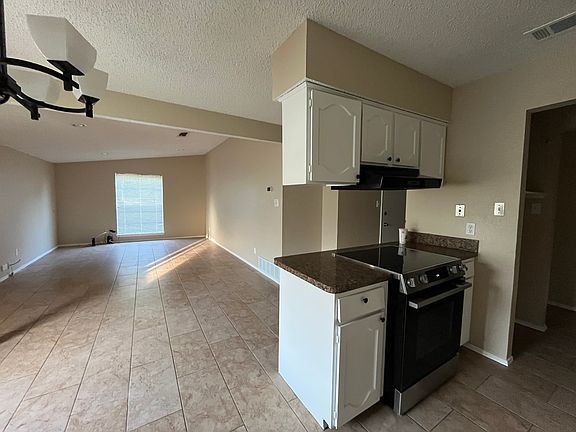 Open concept kitchen, dining, and living area