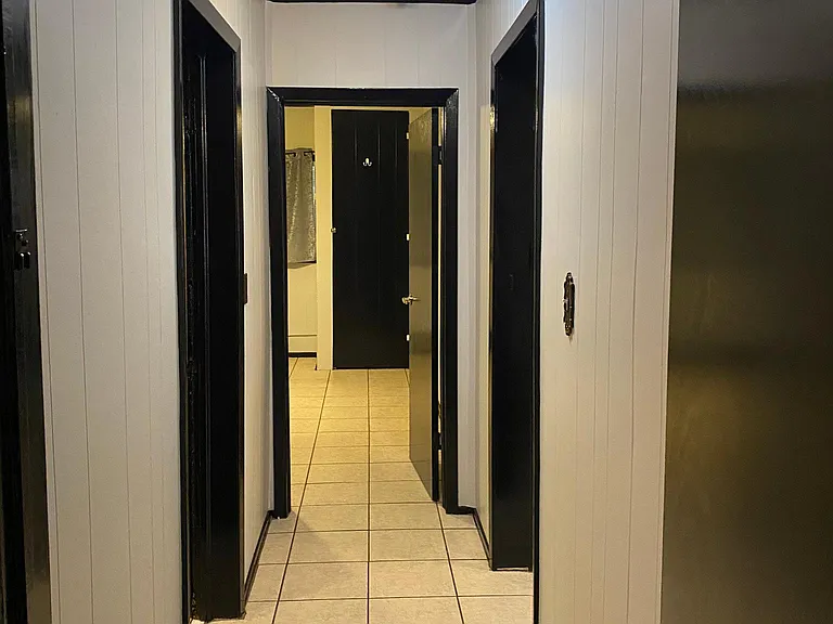 Hall leading to bedrooms and bathroom