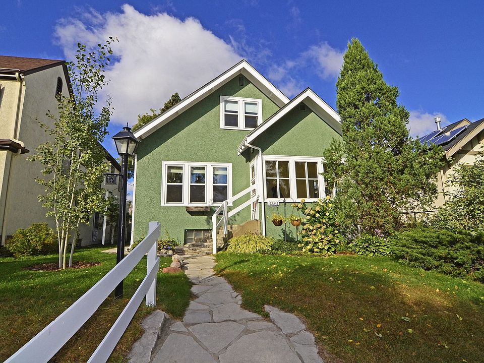 A flagstone path leads you to this utterly charming home!