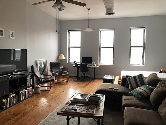 Upstairs is a massive loft bedroom, freshly painted with great natural light.