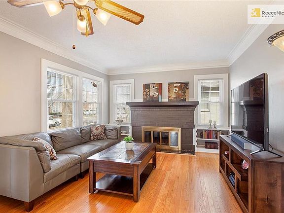 Living room is light and bright - with built-ins surrounding the fireplace.