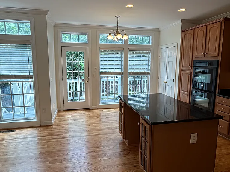 Kitchen on the right, door to the deck, breakfast nook to the left