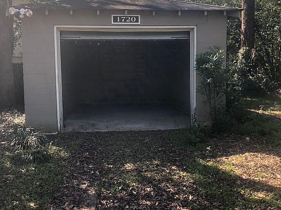 Detached garage with garage door.