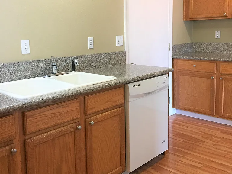 Kitchen conveniently located next to door to garage