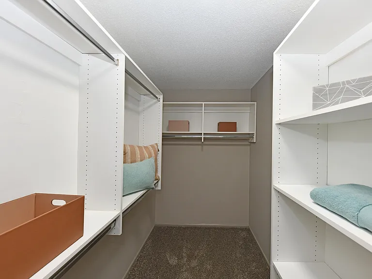 Generous closet space with built-in shelving