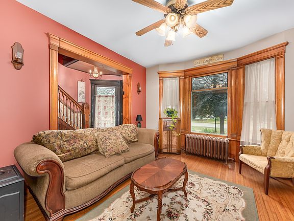 Original trim, lead glass windows, bay windows, and HW floors throughout most of home!