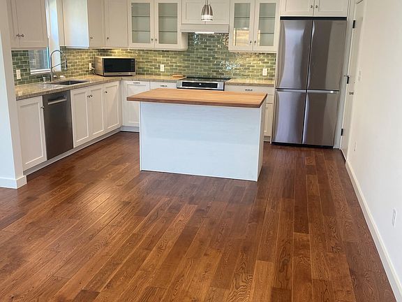 Kitchen / Living Room - The house is 100% electric. No gas. No utility bills. Even internet is provided. 
 Topline appliances. Everything is brand new. The house was only completed in late August of this year. Hardwood floors through. Not vinyl.