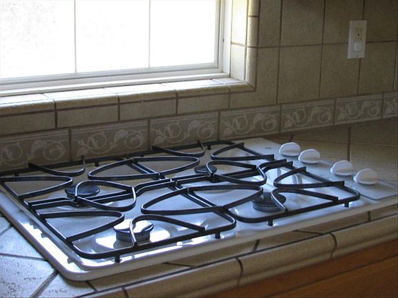 Gas top, double built in oven, microwave, dishwasher and large pantry.