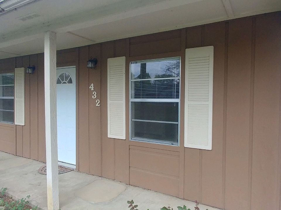 Covered front entry extends for the full width of home.