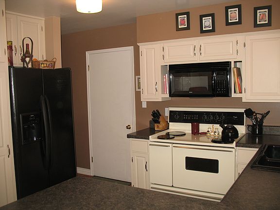Updated kitchen with new paint, flooring, counters and more.