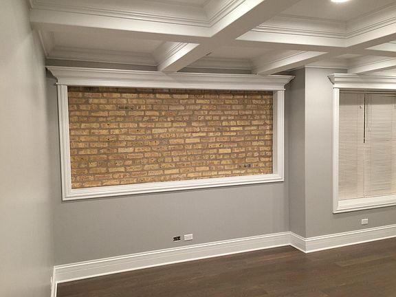 living room - exposed brick wall, great for TV