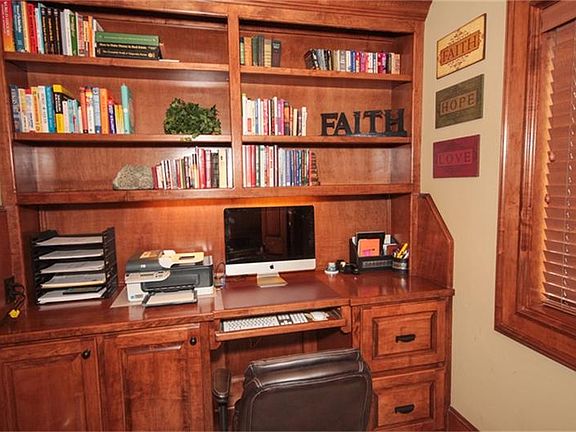  Study alcove with built-in desk and shelves.