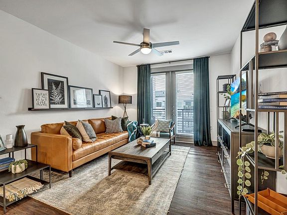 Nexus East Living Room with Private Patio and Hardwood Floors