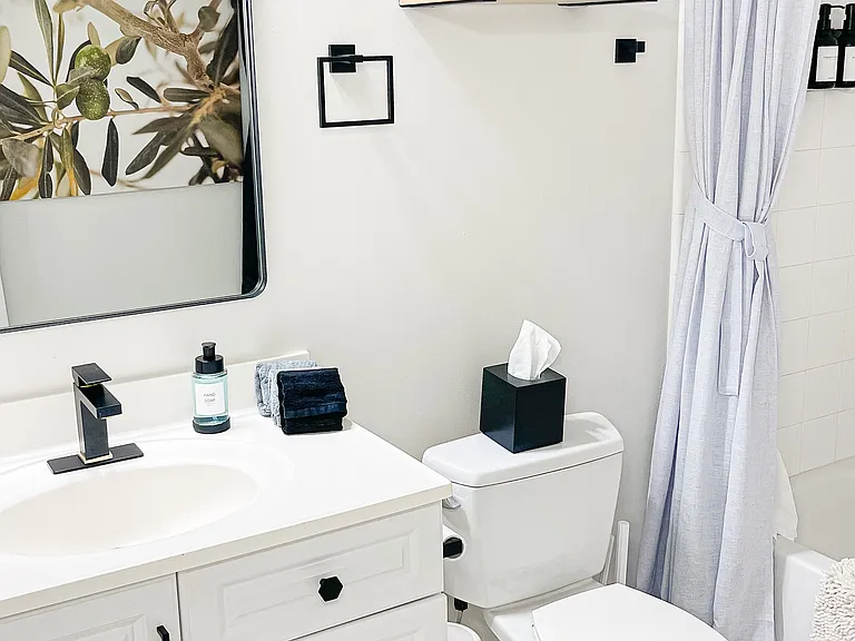 Spacious tub and shower with modern fixtures for daily comfort.